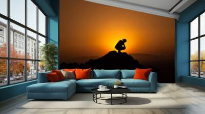 silhouette of a man watching the sunset Wall mural