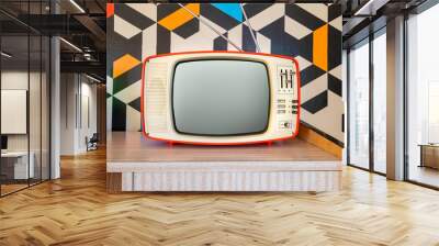 Retro television with vintage wallpaper in the background. Interior decoration from the 70s Wall mural