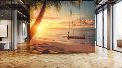 A wooden swing hangs from a palm tree on a tropical beach. The sun sets over the sea, casting a warm glow over the scene.  Wall mural