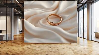 Chic satin fabric with soft pleats adorned by two timeless gold wedding bands. A captivating backdrop for wedding celebrations, providing inspiration for designers Wall mural