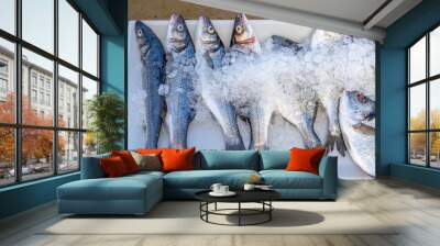 Fresh fish on ice for sale at a market Italy Wall mural