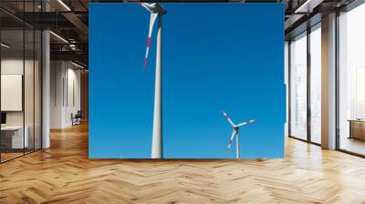 Windwheels in front of a blue sky in Germany Wall mural