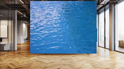 Blue water surface background. Rippled water texture. Swimming pool surface Wall mural