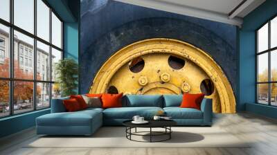 Heavy machinery wheel closeup. Rustic machine tire. Tractor or grader detail. Heavy machinery wheel closeup. Wall mural