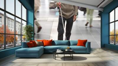 Blind man uses the tactile guidance system in the station Wall mural