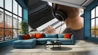 Blind person working on computer with braille display and screen Wall mural