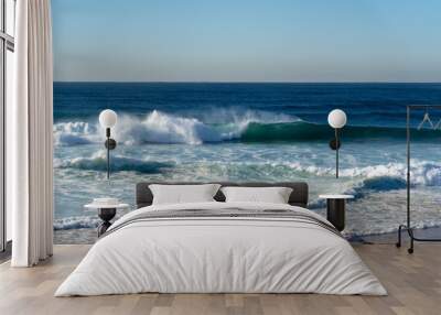 Big waves at the beach crashing onto the shore Wall mural