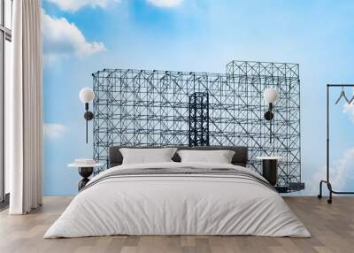 Steel structure billboard. Against blue sky Wall mural