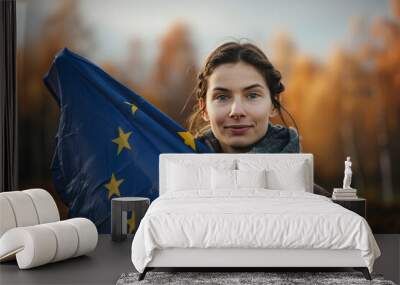 Woman holding the European flag, patriotism Wall mural