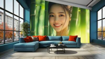 Asian woman smiles in green bamboo Wall mural