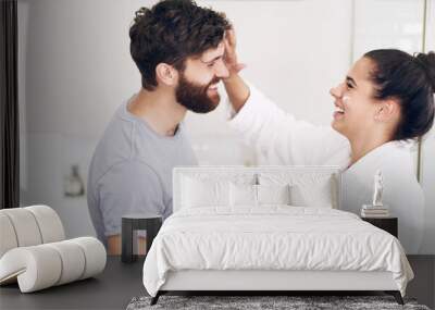 Couple, face skincare cream and bathroom with smile, helping hand and morning together in home. Woman, man and skin wellness for help, care or laughing with product for lifestyle, beauty or health Wall mural