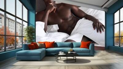 Naked, art and sexy black man with towel on a bed to relax and rest in the morning. Sexuality, erotic and nude body of African person with strong muscles, nudity and confidence in hotel bedroom Wall mural