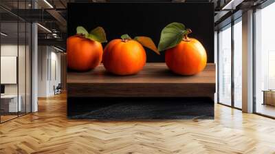 Ripe persimmon on wood, top view. Wall mural