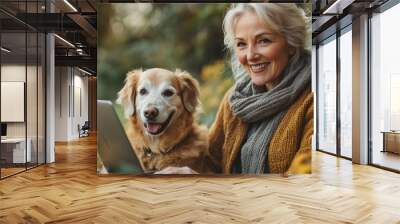 happy senior woman with laptop and dog working outdoors in garden home office concept Wall mural