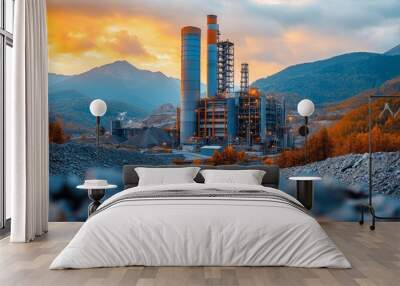 A green chemistry facility operates in mountainous terrain, extracting metals amidst a stunning sunset backdrop. Wall mural