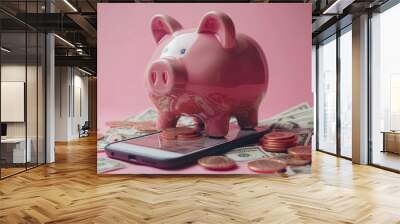 A pink piggy bank sits atop a smartphone, surrounded by coins and dollar bills on a pink background. Wall mural