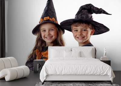 Adorable kids in witch and wizard costumes on white background. Halloween party and festive concept Wall mural