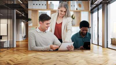 Elderly businesswoman leader, executive or mentor helping to coach and train new employees. Young intern getting help and coaching from professional business expert, CEO and boss in modern office Wall mural