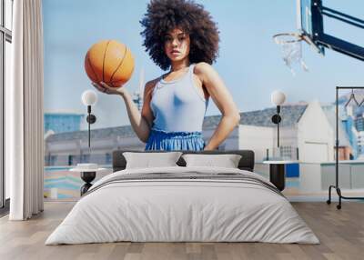 Basketball court, fashion and portrait of black woman in city with attitude, urban style and trendy clothes. Sports, fitness park and girl model outdoors with ball for leisure, confident and stylish Wall mural