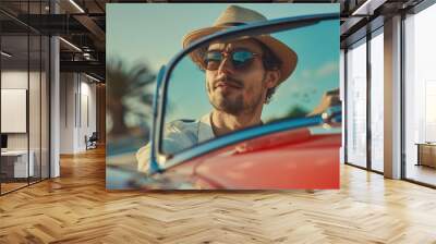 Man wearing a hat and glasses driving a sports car Wall mural