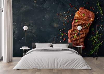 Organic beef steak with spices on dark background Overhead view with space for text Wall mural