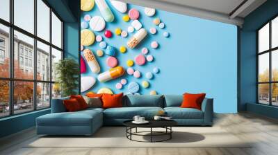 Various pharmaceutical medication on blue background with space for text Wall mural