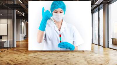 Young female doctor doing a blood test in a laboratory. drug and medical vaccine finding studies. health concept. Wall mural