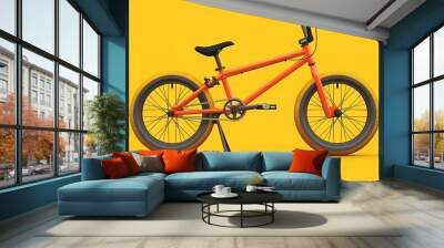 orange bmx bike isolated on yellow background Wall mural