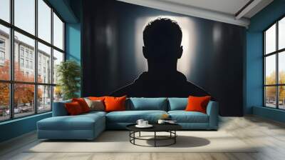 Silhouette of a man in a dark place Wall mural