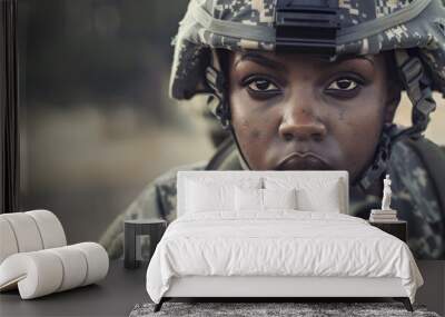 A woman in a military uniform is looking at the camera Wall mural