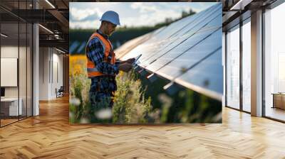 Engineer working in the solar panel site control installing for solar farm renewable energy Wall mural