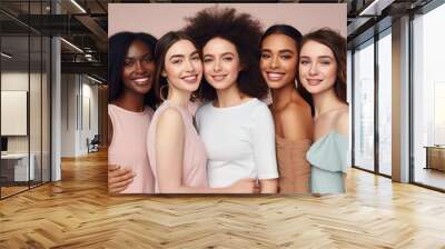 Portrait of three young multiracial women standing together and smiling at the camera isolated over a pastel background Wall mural