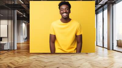 portrait of young african smiling wearing white shirt on the yellow pastel Wall mural