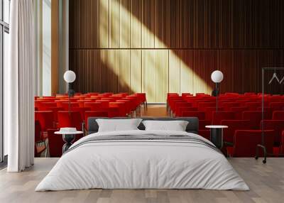 Empty Conference Hall with Rows of red Chairs, Capturing the Calm Before a Busy Meeting or Presentation Wall mural