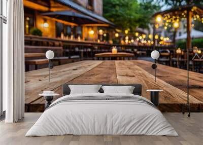 photo wooden table and blurred background of outdoor restaurant with bokeh light. High quality photo  Wall mural