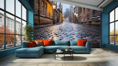 A quaint, cobblestone street covered in the first snow of winter Wall mural