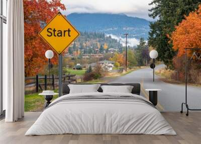 An empty asphalt road with the word 