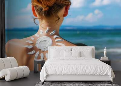 Close up of woman back with sun shaped white cream on it, skin care and protection from sunlight concept Wall mural