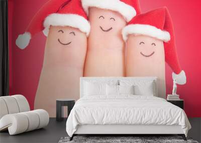 fingers faces in santa hats. happy family celebrating concept fo Wall mural