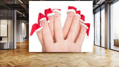 fingers faces in santa hats. happy family celebrating concept fo Wall mural