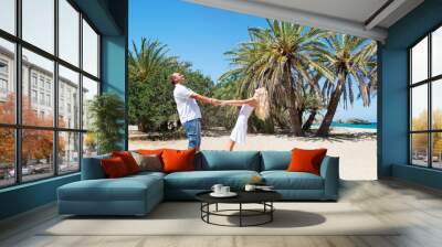 loving couple against tropical palm sea beach Wall mural