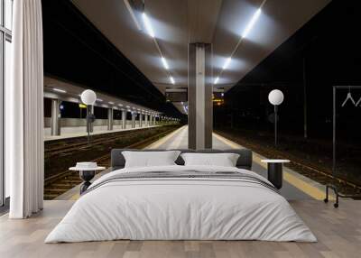 Evening shot of the train station and waiting area of passengers in Giarre, Catania , Sicily Wall mural