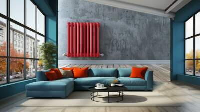 A classic red radiator against a gray wall, placed on a wooden floor, showcasing a clean and modern home interior. The radiator is central to heating in cooler climates Wall mural