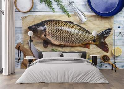 Cooking fish. Fresh carp and ingredients on white table. Preparing healthy eating Wall mural