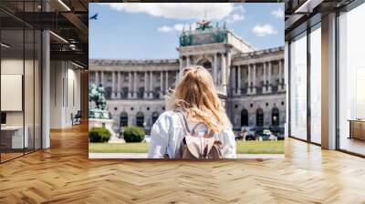 Woman looking to Hofburg in Vienna. Tourist traveling in Austria Wall mural