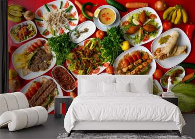 Delicious meat kebab with fresh vegetable salad served with variety of Turkish dishes and appetizers. Top view of assorted Turkish food and meze, tasty and healthy Mediterranean cuisine. Wall mural