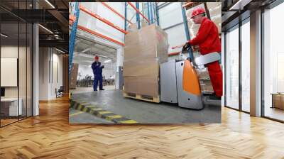 goods delivery - two workers working in storehouse Wall mural