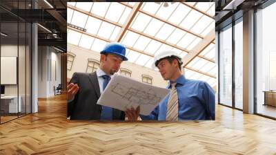 Two architects reviewing the blueprints Wall mural