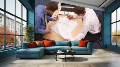 two architects reviewing the blueprints Wall mural