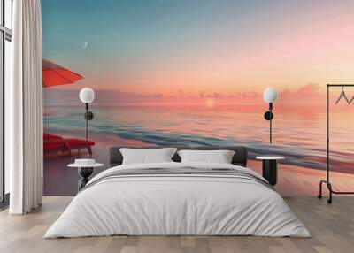 A beautiful tropical beach at sunset with two red sun loungers and an umbrella, palm trees in the background Wall mural